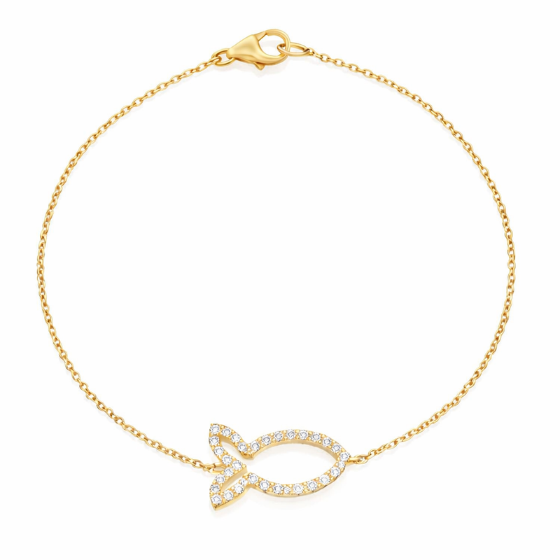 Gold bracelet with fish-shaped charm on a yellow background