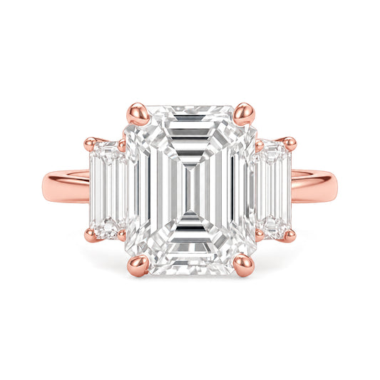 Ella Ring rose gold emerald-cut three-stone diamond ring on a white background