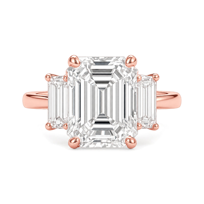 Ella Ring rose gold emerald-cut three-stone diamond ring on a white background