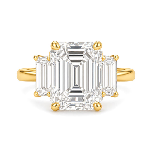 Ella Ring Lab Diamond yellow gold emerald-cut three-stone ring on a white background